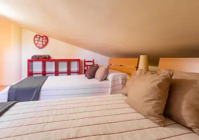 a bedroom with a large white bed and a window at Villa Sitges Ilusión 15 minutes by car from Sitges Sleeps 16 people XXL swimming pool in Olivella