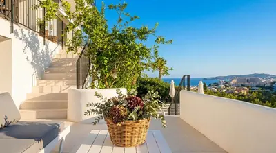 a kitchen and dining room with a view of a patio at Villa Sitges Colonial. Impressive views of the sea. High design. Renovated. in Sitges