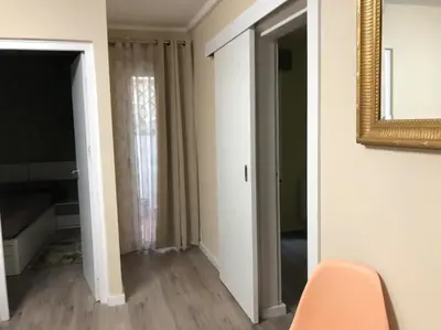 a room with a mirror and a hallway with a door at COMFORTABLE APARTMENT CLOSE TO BUNKERS DEL CARMEL! in Barcelona