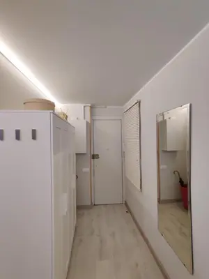 an empty room with a mirror and a hallway at Fira Plaza España apartment in Barcelona