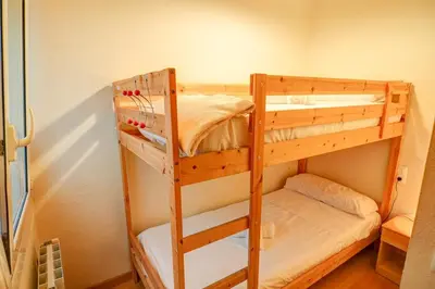 a couple of bunk beds in a room at Hermione Apartment by Hello Homes Sitges in Sitges