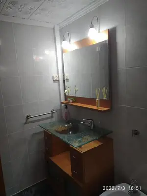a bathroom with a sink and a mirror at Apartamento Bella Carmen : para 6 personas in Cunit