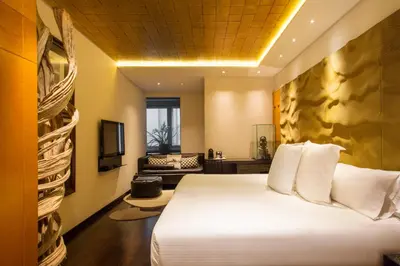 a hotel room with a bed and a couch at Claris Hotel & Spa GL, a Small Luxury Hotel of the World in Barcelona