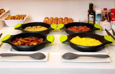 four bowls of food sitting on a counter with food at HCC Taber in Barcelona