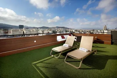 a conference room with tables and chairs and a city at HCC Regente in Barcelona