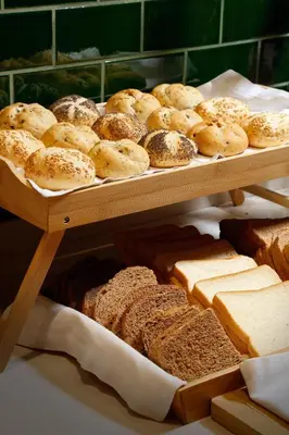 a display of bread and pastries in a bakery at HCC St. Moritz in Barcelona