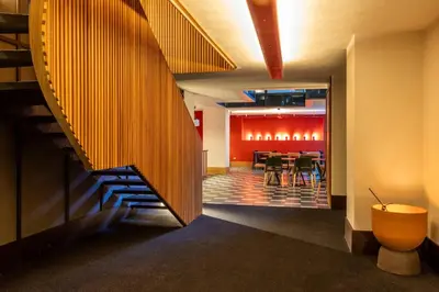 a lobby with a staircase and a dining room at Onix Fira in Barcelona
