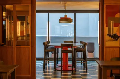a dining room with a table and some chairs at Onix Fira in Barcelona