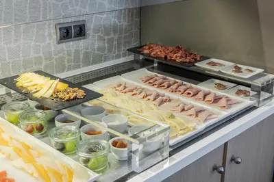 a buffet with many different types of food on display at Ilunion Almirante in Barcelona