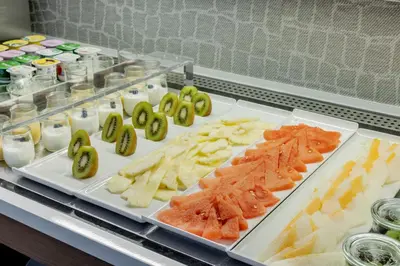 a buffet with different types of food on a table at Ilunion Almirante in Barcelona