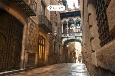 an alley with an arch between two buildings at Eurostars Cristal Palace in Barcelona