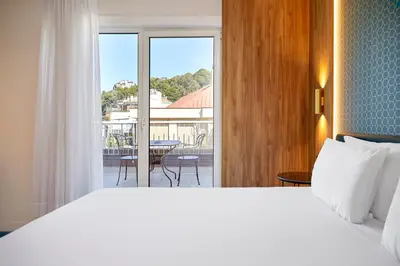 a bedroom with a bed and a view of a patio at Exe Mitre in Barcelona