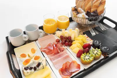 a glass plate with pastries on a table at La França Travellers in Barcelona