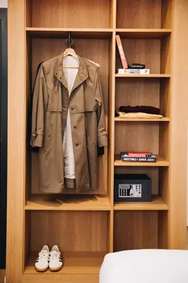 a closet with a jacket and shoes in it at H La Paloma Boutique in Barcelona