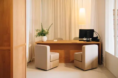 a office with a desk with a computer and two chairs at H La Paloma Boutique in Barcelona
