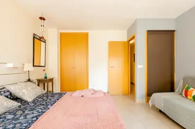 a bedroom with a bed and a couch at Apt.p/5 15min from Barcelona and Beaches W/Terrace in Sant Adria de Besos