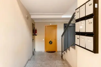 a hallway with a yellow door in a building at Apt.p/5 15min from Barcelona and Beaches W/Terrace in Sant Adria de Besos