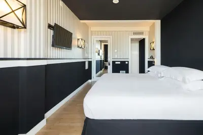 a hotel room with a bed and a desk at Europark in Barcelona