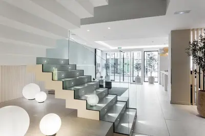 a staircase in a house with white walls and ceilings at Royal Ramblas in Barcelona