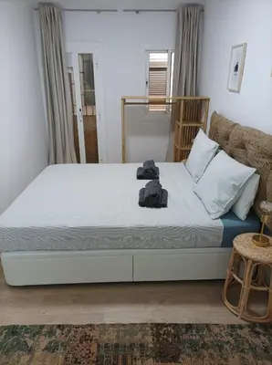 a bedroom with a bed and a couch at COOL! 5' to metro. 15' to Center/beach by metro. in Santa Coloma de Gramanet