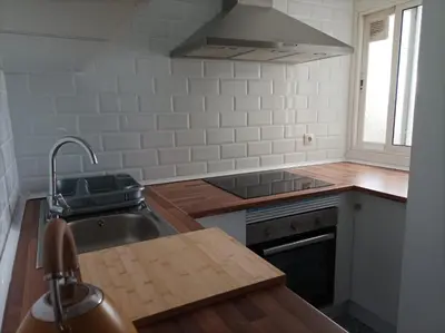 a kitchen with a sink and a stove at COOL! 5' to metro. 15' to Center/beach by metro. in Santa Coloma de Gramanet