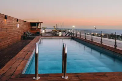 a patio with a table and chairs on a deck at Eurohotel Diagonal Port in Barcelona