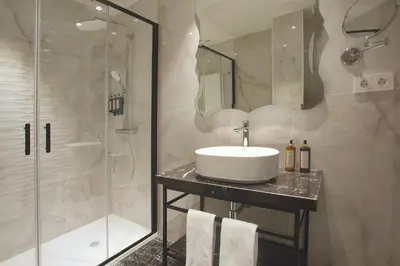a bathroom with a sink and a shower at Eurostars Laietana in Barcelona