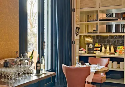 a dining room with a table with wine glasses at Boutique Hotel H10 Catalunya Plaza in Barcelona