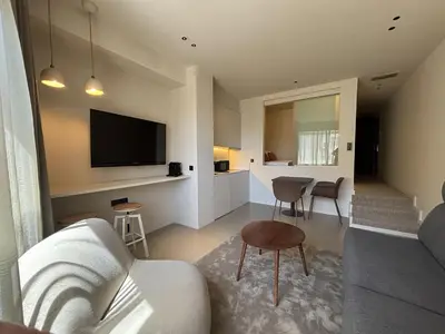 a living room with a couch and a table at Senator Barcelona Apartments in Barcelona