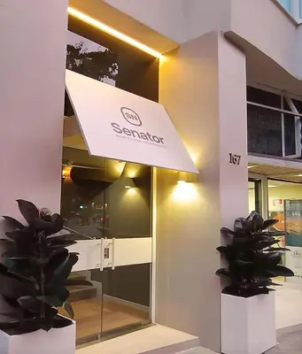 a building with a sign on the side of it at Senator Barcelona Apartments in Barcelona