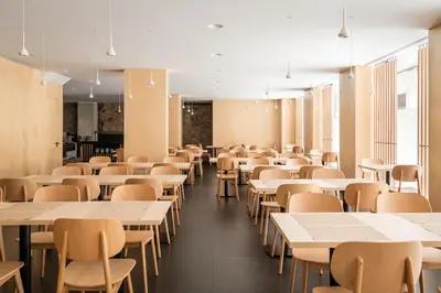 a dining room with tables and chairs andermottermott at Ronda House in Barcelona