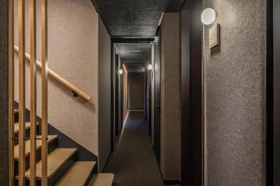 a hallway with stairs in a building at Ronda House in Barcelona