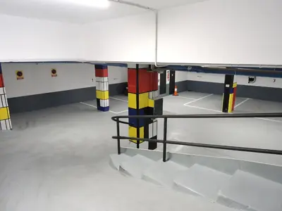 a room with multicolored poles in a room at Ronda House in Barcelona