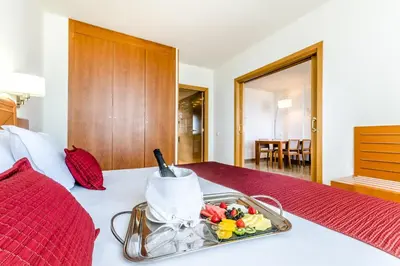 a tray of food on a bed in a room at Exe Barbera Parc in Barbera del Valles