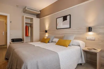 a bedroom with two beds in a room at Bonanova Park in Barcelona