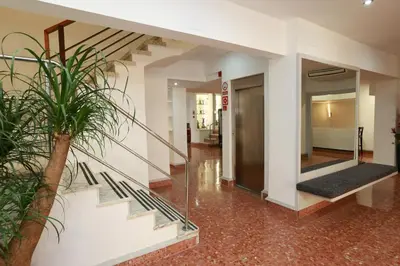 a hallway with a staircase in a building at Hotel Alguer Camp Nou in Barcelona