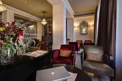 a room with a table and chairs and a laptop at Hotel Condado in Barcelona