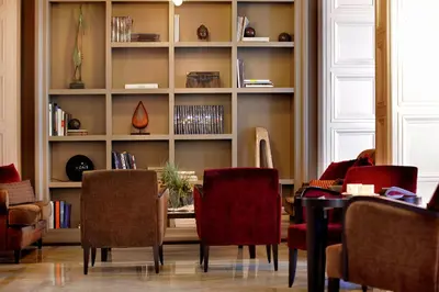 a dining room with a table and chairs at Hotel Condado in Barcelona