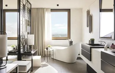 a bathroom with a tub and a sink at Grand Hyatt Barcelona in Barcelona