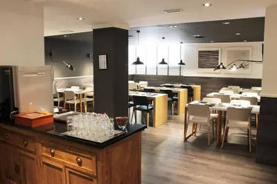 a kitchen with a counter with a coffee maker on it at Paral·lel in Barcelona