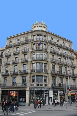 a large building on the corner of a street at Hotel Monegal in Barcelona