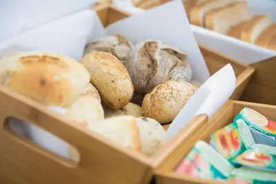 two wooden boxes filled with different types of bread at Casual Colours Barcelona in Barcelona