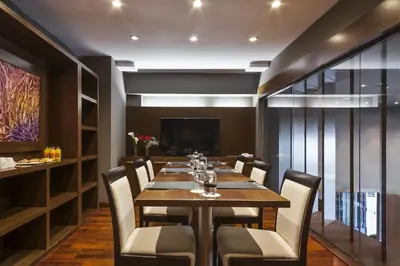 a dining room with a long table and chairs at Acta Atrium Palace in Barcelona