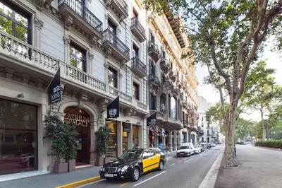 a car parked on a street in front of buildings at Acta Atrium Palace in Barcelona