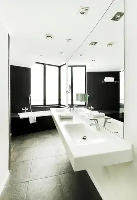 a bathroom with three sinks and a large mirror at Hotel Alimara in Barcelona