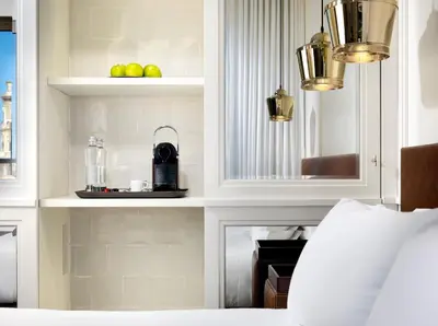 a bedroom with a bed and a shelf with fruit on it at Boutique Hotel H10 Montcada in Barcelona