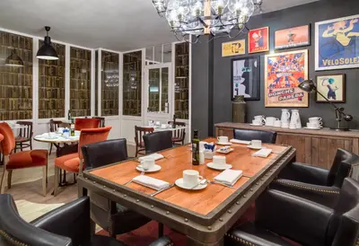 a dining room with a table and chairs at Boutique Hotel H10 Montcada in Barcelona