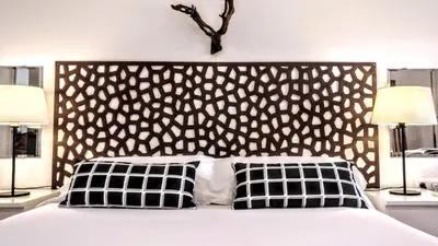 a bedroom with a large bed with two lamps at BizFlats Garden House in Barcelona