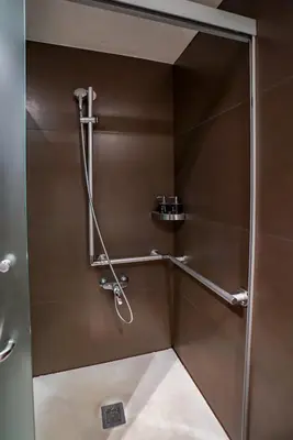 a shower with a glass door in a bathroom at Hotel Constanza in Barcelona