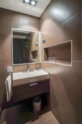 a bathroom with a sink and a mirror at Hotel Constanza in Barcelona